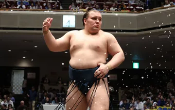 Sumo wrestler Aonishiki in a blue mawashi after his win on day 10 of the Aki Basho 2026 tournament
