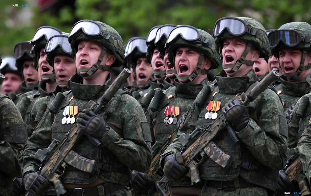 Russian soldiers with rifles and medals amid Duma deputies' demand to pull troops out from Lyman