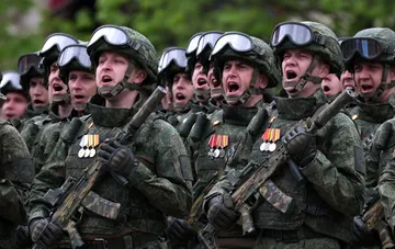Russian soldiers with rifles and medals amid Duma deputies' demand to pull troops out from Lyman
