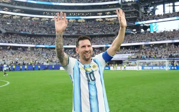 Lionel Messi in Argentina's farewell jersey waves to fans before his final match for the national team