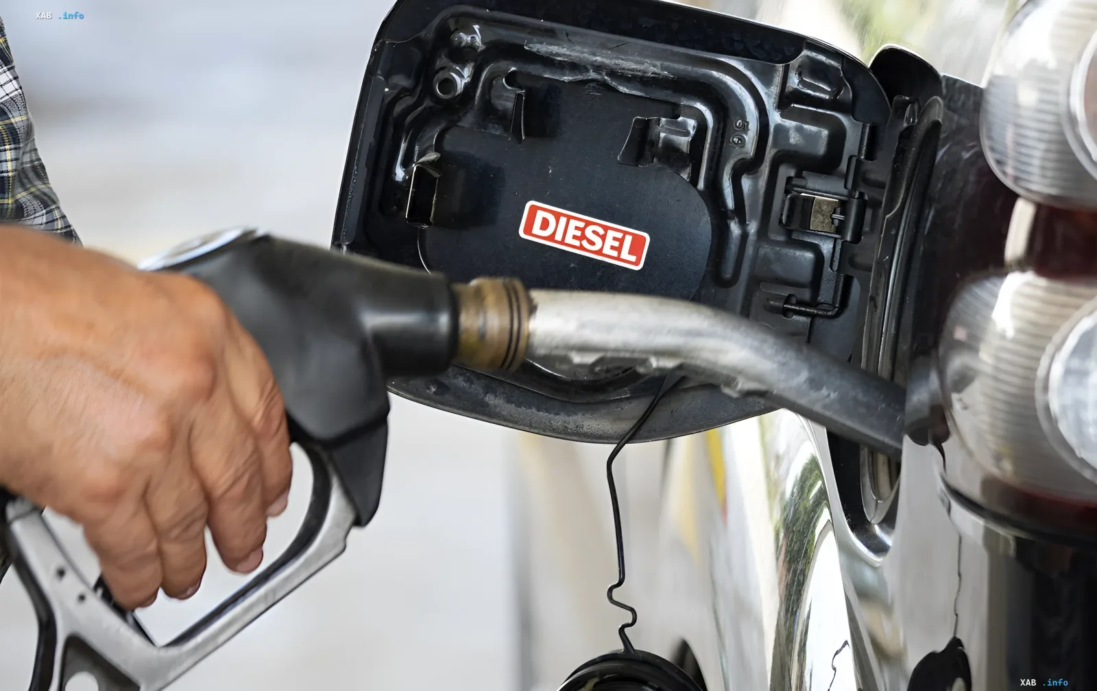 Refueling a car with diesel fuel at a gas station in Russia amid potential extension of diesel export ban