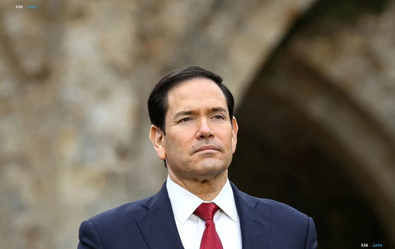US Secretary of State Marco Rubio in a formal suit against a stone wall backdrop, in the context of Washington's complaint to Ukraine over attacks on US-linked vessels
