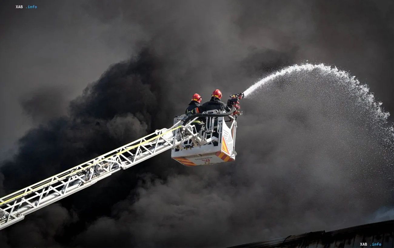 Firefighters extinguish a warehouse complex after a strike in Odesa region