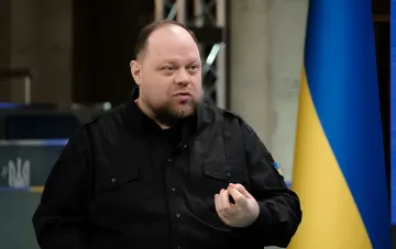 Stefanchuk in front of the Ukrainian flag commenting on why elections in the Diia app are not yet possible