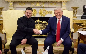 Volodymyr Zelenskyy and Donald Trump shake hands in the Oval Office