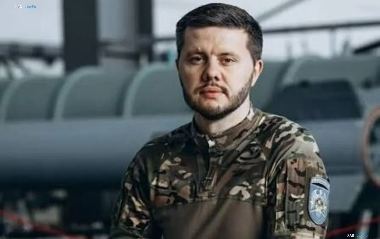 Ukrainian Armed Forces Major Oleksiy Reva in camouflage uniform in front of military equipment