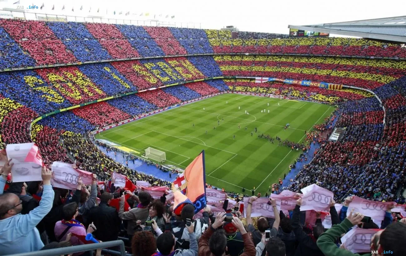 FC Barcelona fans at Camp Nou stadium creating a tifo before a match