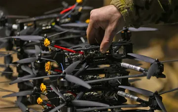 Ukrainian defence force soldier configuring a combat drone procured via the DOT-Chain Defence marketplace