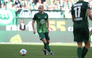 Christian Eriksen in a Wolfsburg kit during a match — the midfielder terminated his contract after a second cardiac arrest