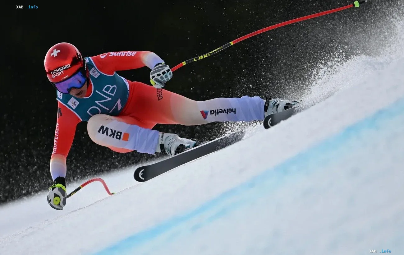 A skier carving a sharp turn on a snow-covered course in international FIS cross-country and alpine skiing competitions