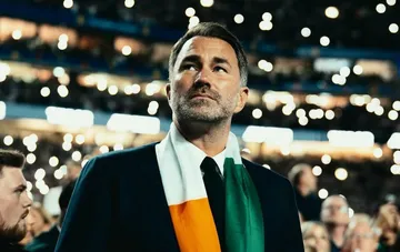 Eddie Hearn with an Irish flag at a stadium at the centre of the Tyson Fury controversy over Anthony Joshua's humiliation