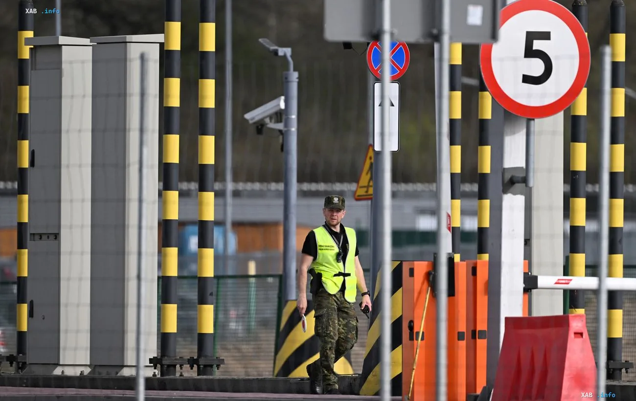 Security officer at a Polish-Ukrainian border crossing point under heightened readiness