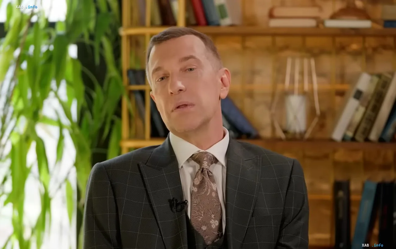 Sergey Sosyodov, former X-Factor judge and music critic, in a business suit during an interview