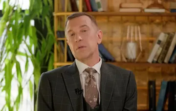 Sergey Sosyodov, former X-Factor judge and music critic, in a business suit during an interview