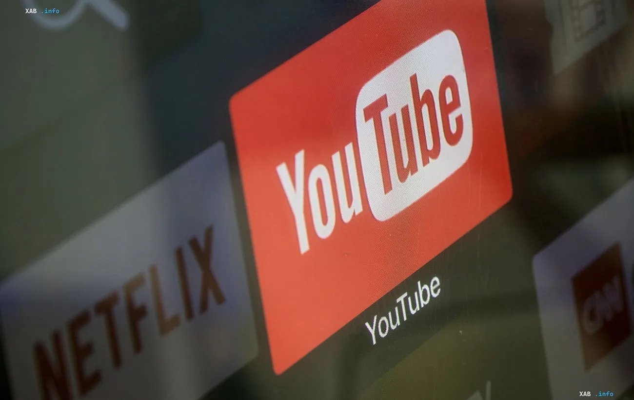 YouTube logo on a device screen highlighting the launch of Gemini-powered personalized feeds