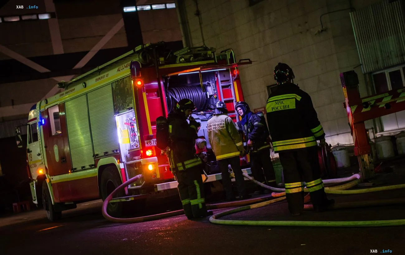 Russian Ministry of Emergency Situations firefighters at the scene of a fire in a hypermarket in occupied Luhansk after a drone attack