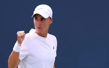 Angelina Kalinina celebrates victory at the Billie Jean King Cup