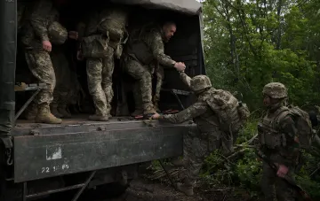 Ukrainian military at positions during a successful counteroffensive