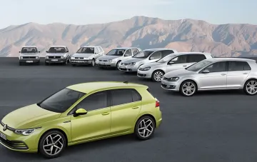 Buyer examining maintenance costs for new and used cars