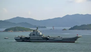 US and Chinese military warships in the ocean