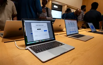 macOS interface and Apple logo on a laptop screen