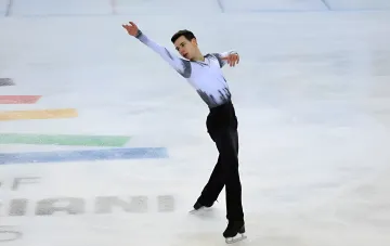 Ukrainian figure skater Yegor Kurtsev on the ice arena during his performance