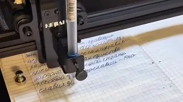 Robot holding a pen and writing in a notebook