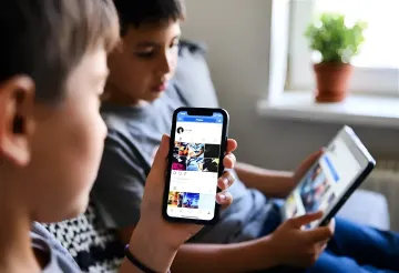 Smartphone with open social media apps against the background of Turkish state symbols