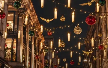 Oxford Street festive illuminations in London featuring Harry Potter style floating candles and baubles