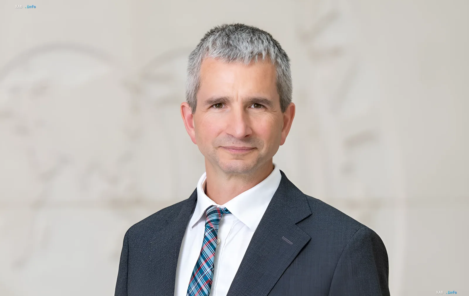 IMF European Department Director Mateusz Szczurek in a formal suit against a neutral background