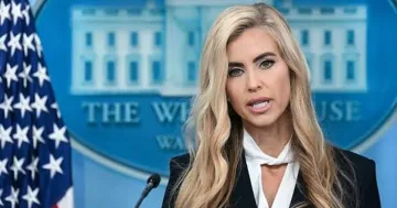 Katie Zakaria speaking at the White House podium in front of the American flag