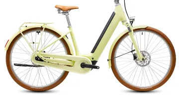 Світло-жовтий міський електровелосипед Cube Aruba Hybrid з коричневими шинами та сідлом