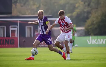 Two football players fighting for the ball during a Ukrainian Premier League match