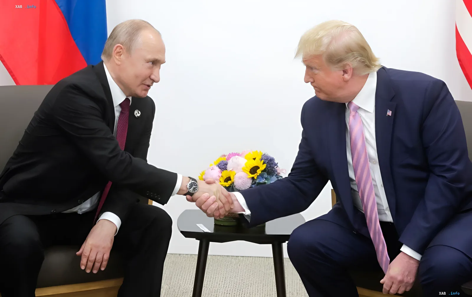 Vladimir Putin and Donald Trump shaking hands during an official meeting