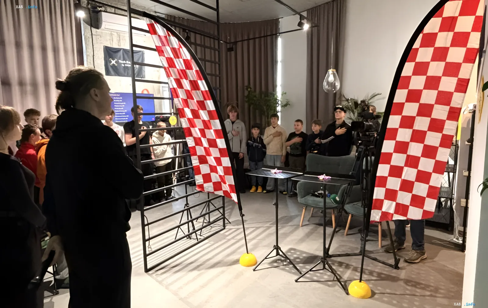 Children and teenagers participating in an indoor micro-drone piloting competition in Kyiv
