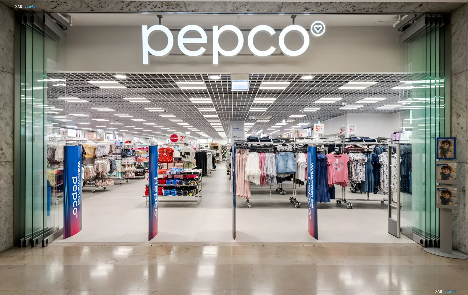 Entrance to a Pepco store with a bright branded logo and storefront inside a shopping mall