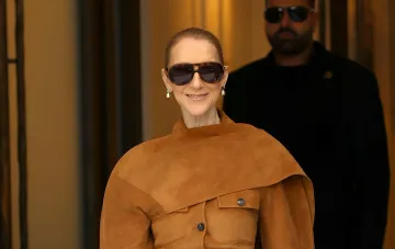 Celine Dion wearing a brown Ferragamo suede outfit and sunglasses in Paris