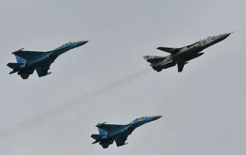 Military fighter jets of the Ukrainian Air Forces flying in the sky in combat readiness