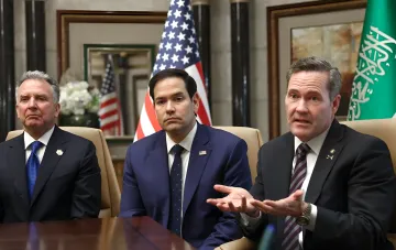American and Saudi representatives at a conference table during negotiations