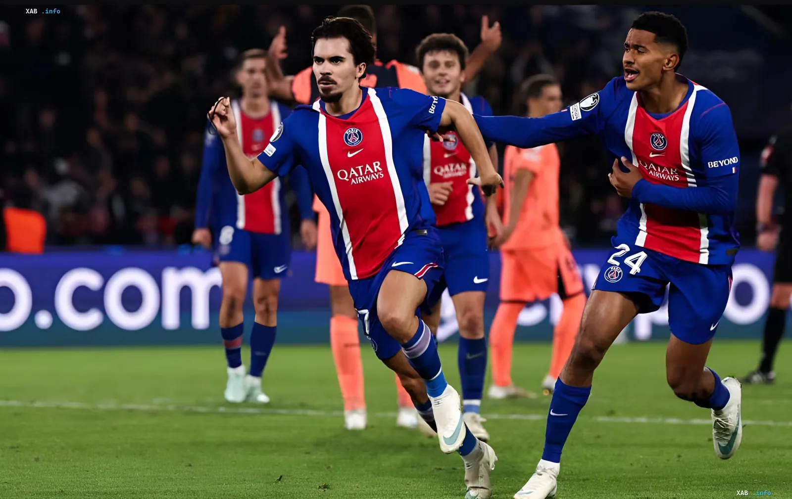 Footballers in blue and red kits celebrate a goal in a Champions League match