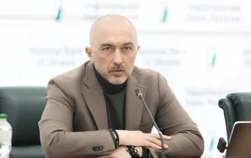 National Bank of Ukraine Governor Andrii Pyshnyy wearing a business jacket during a press conference