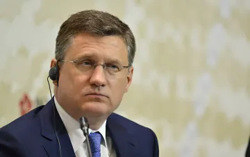 Russian Deputy Prime Minister Alexander Novak wearing a business suit during an event