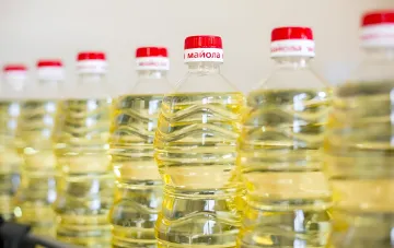 Bottles of sunflower oil in a row at a factory