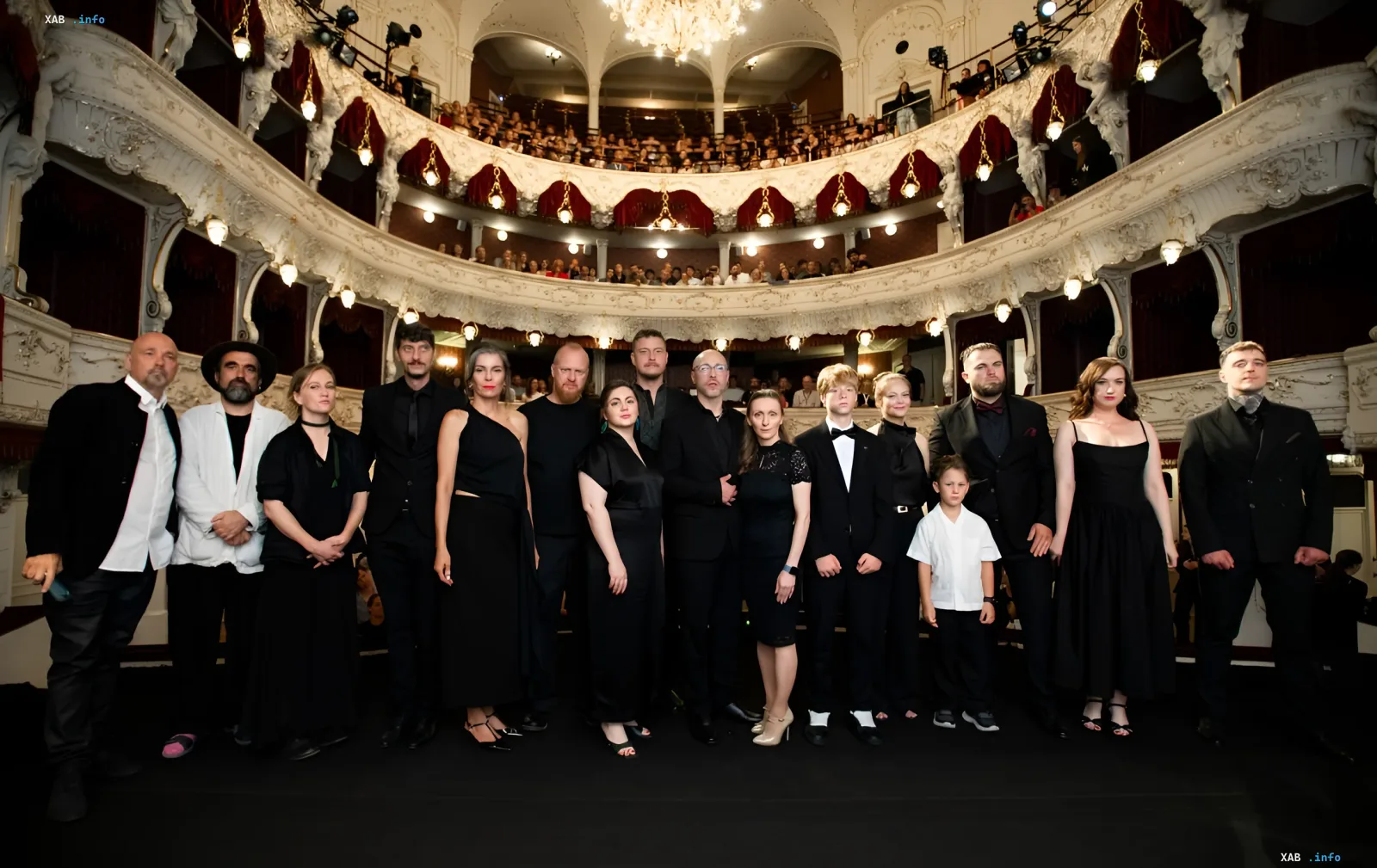 Director and crew members of TO DIE TO LIVE on stage in a historic theater before the audience