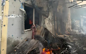 Aftermath of shelling and a destroyed university building in Uman with fire and debris