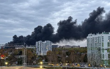 Thick black smoke rises over residential areas and construction sites in Orel, Russia, following a missile strike