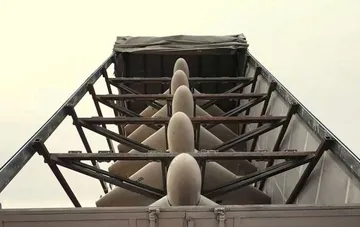 Footage of a production line or military drone transportation inside an industrial container