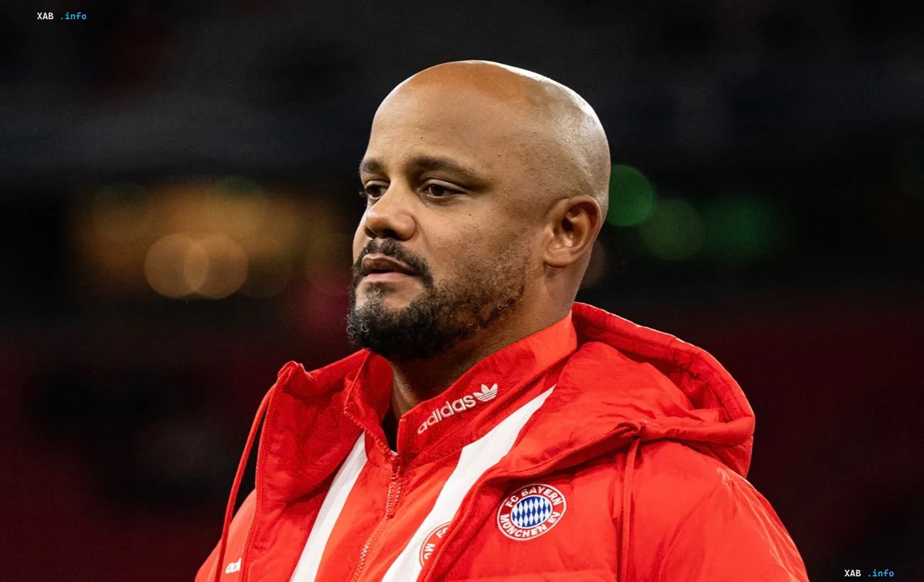 Bayern Munich head coach Vincent Kompany wearing a red sports jacket at the stadium