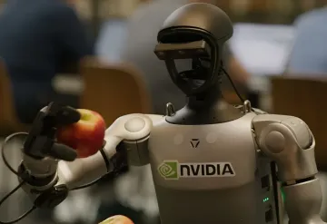 Гуманоїдний робот з логотипом Nvidia тримає в механічній руці червоне яблуко