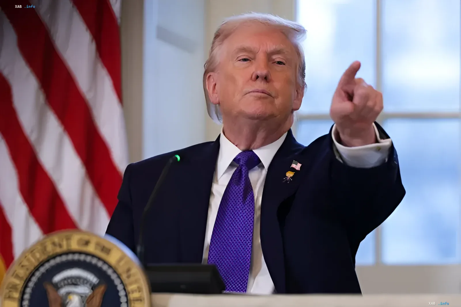U.S. President Donald Trump points a finger emphatically during a press conference